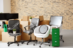 Office furniture and accessories neatly wrapped up and packaged as one of many commercial moving service benefits