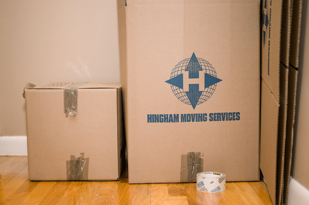 Moving boxes carefully packed as one of many small shipment benefits