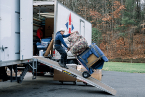 moving company carefully unloading items protected by moving insurance