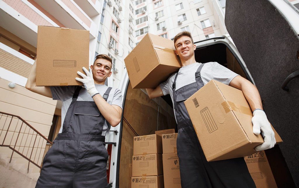 boston movers holding boxes and smiling